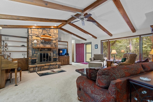 carpeted living room featuring vaulted ceiling with beams, a textured ceiling, a fireplace, and ceiling fan