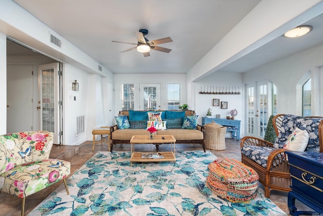 living room with ceiling fan and french doors