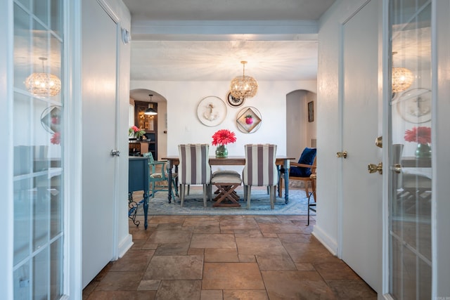 dining area with an inviting chandelier