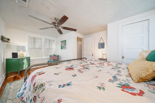 301 Kleinshore # 8, Hot Springs, AR 71913 - bedroom with wood finished floors, a textured ceiling, and a ceiling fan