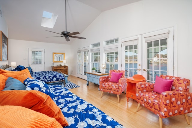 301 Kleinshore # 8, Hot Springs, AR 71913 - bedroom with french doors, a skylight, wood finished floors, access to outside, and high vaulted ceiling