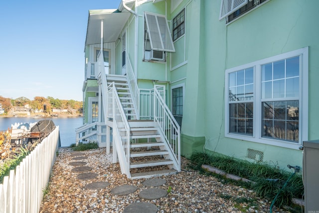 301 Kleinshore # 8, Hot Springs, AR 71913 - view of side of home with stairs, a water view, fence, and cooling unit