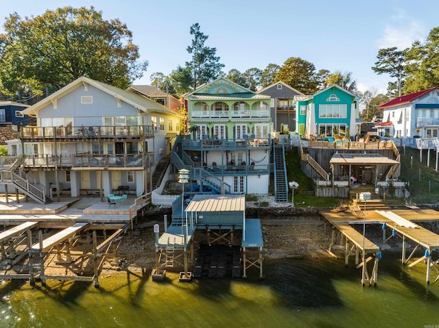 rear view of property with a deck with water view