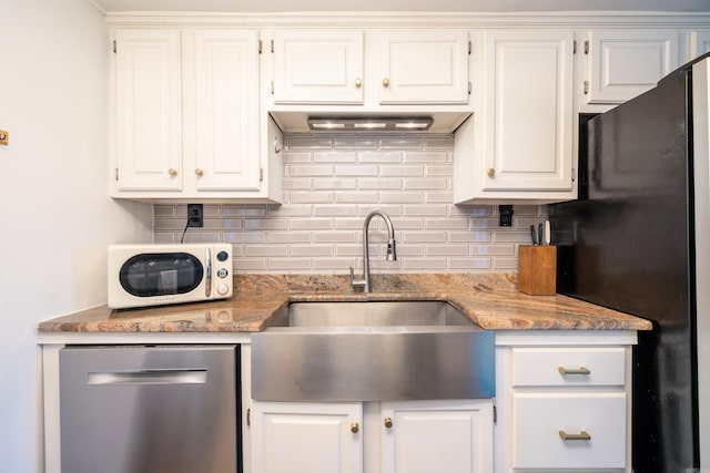 kitchen with white cabinets, sink, fridge, and stainless steel dishwasher