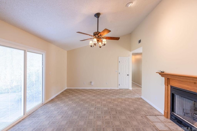 unfurnished living room featuring high vaulted ceiling, ceiling fan, light colored carpet, and a textured ceiling