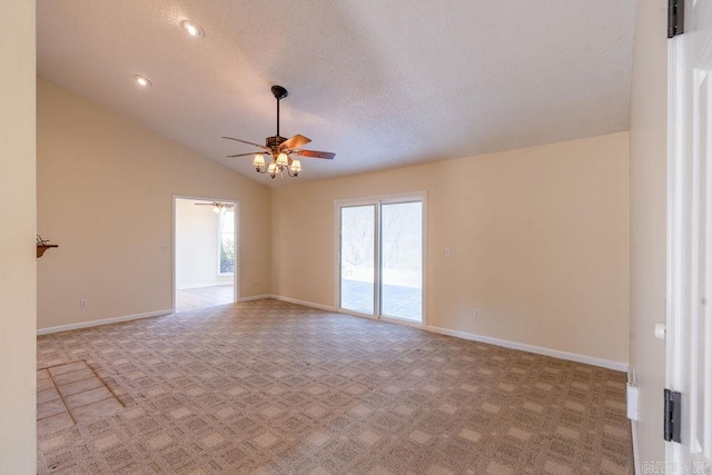 unfurnished room with a textured ceiling, lofted ceiling, ceiling fan, and light colored carpet