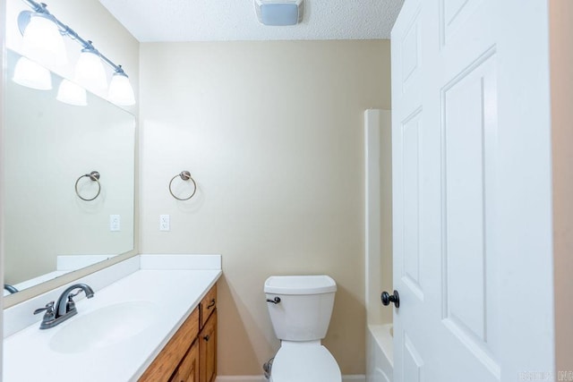 full bathroom with a textured ceiling, shower with separate bathtub, vanity, and toilet