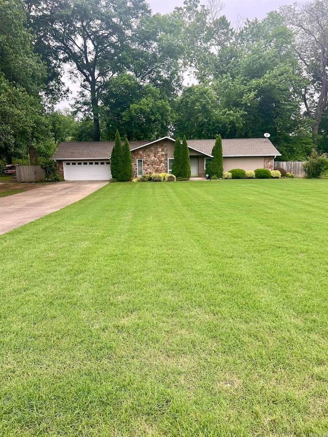 view of front facade with a front yard and a garage