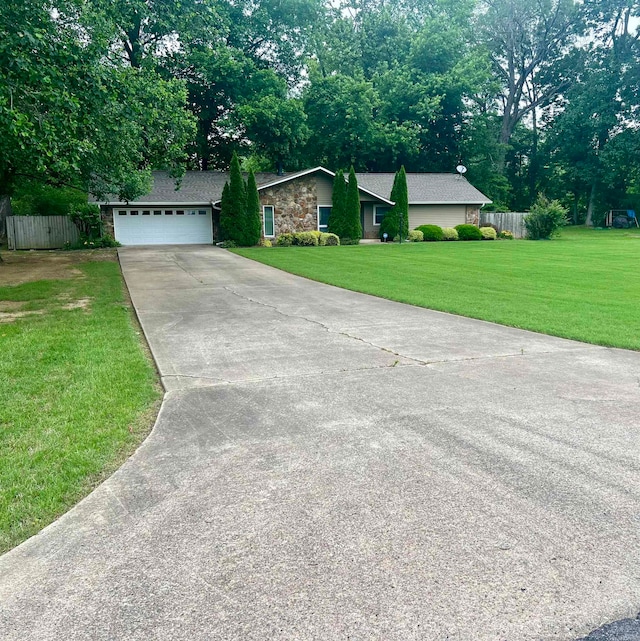 ranch-style home with a front lawn and a garage