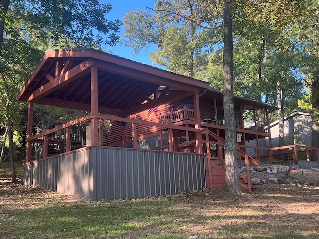 view of property exterior featuring a deck