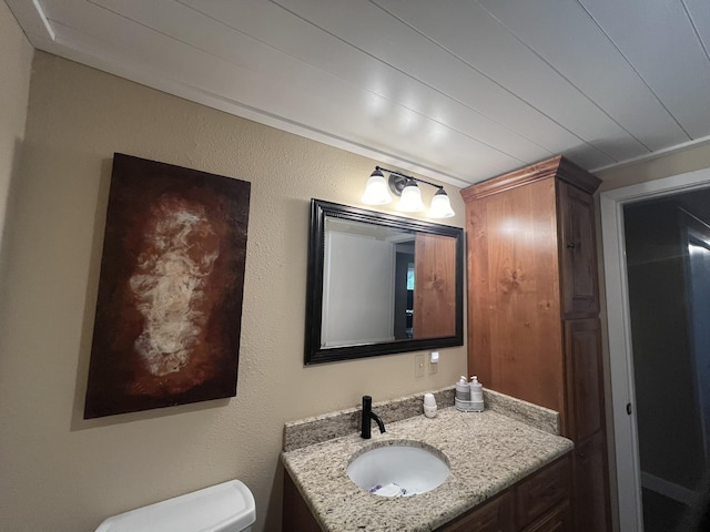 half bath with vanity and toilet