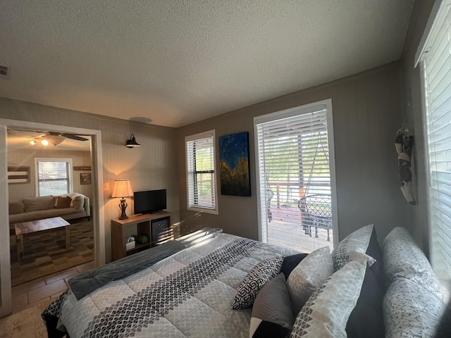 bedroom featuring a textured ceiling and visible vents