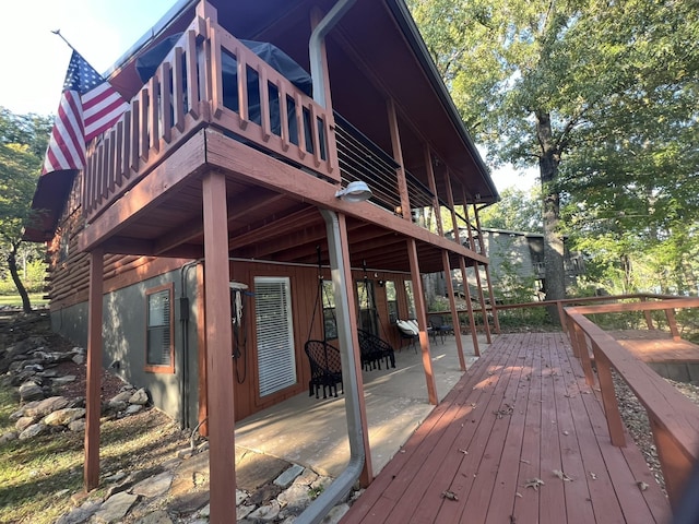 wooden terrace with a patio