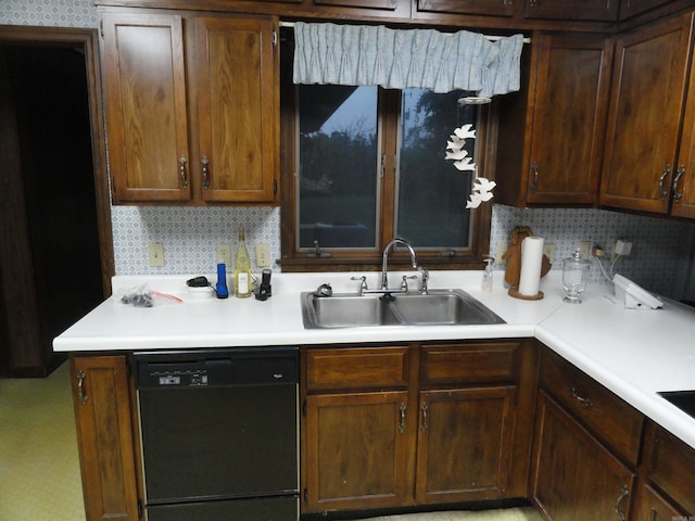 kitchen with dark brown cabinets, decorative backsplash, black dishwasher, and sink