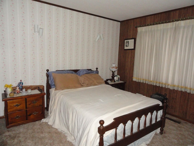 carpeted bedroom with crown molding and wood walls