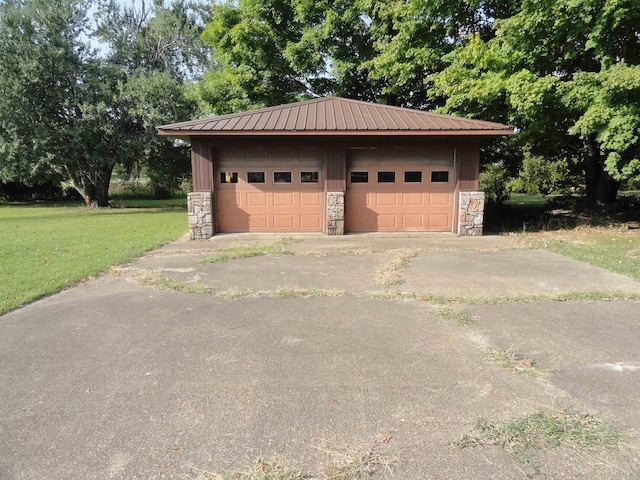 garage featuring a yard