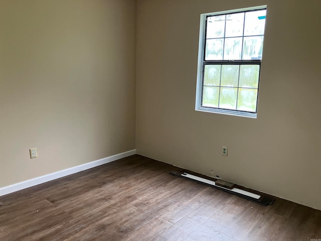 empty room featuring wood-type flooring