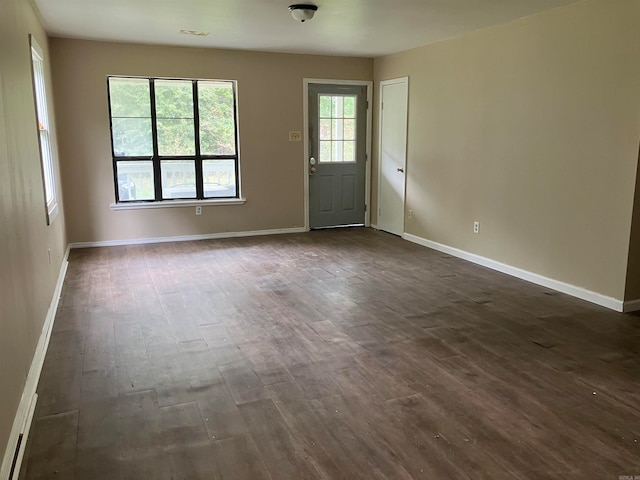 spare room featuring dark hardwood / wood-style floors