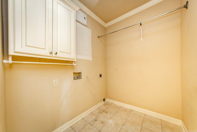 laundry area featuring light tile patterned flooring, washer hookup, electric dryer hookup, cabinets, and ornamental molding