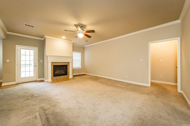 unfurnished living room featuring ceiling fan, ornamental molding, and a tile fireplace