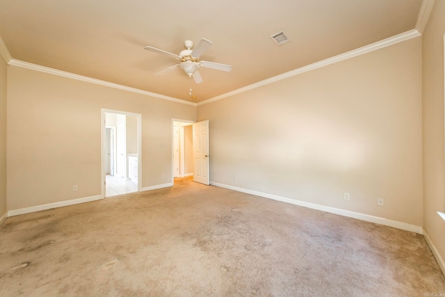 empty room with ceiling fan, carpet floors, and ornamental molding