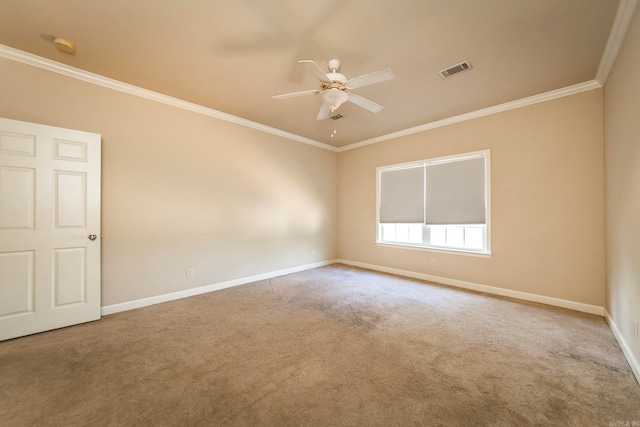 spare room featuring ornamental molding, ceiling fan, and carpet flooring