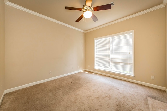 carpeted spare room featuring ceiling fan and crown molding