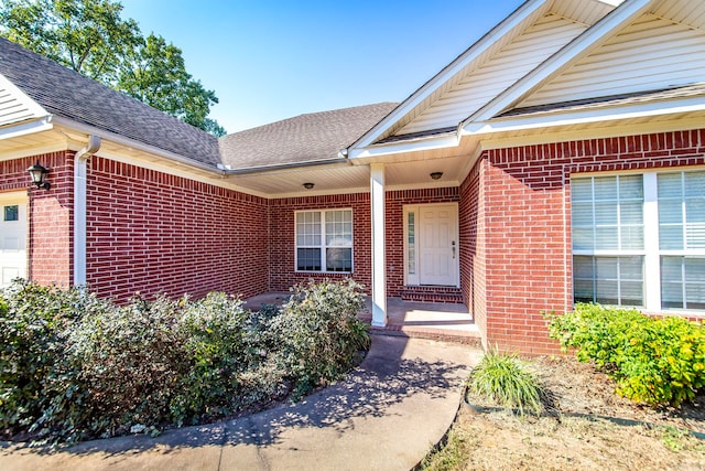 property entrance with covered porch