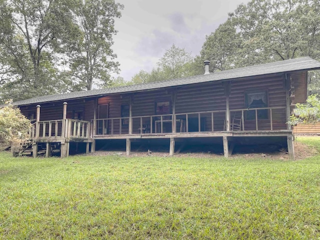 back of house featuring a yard