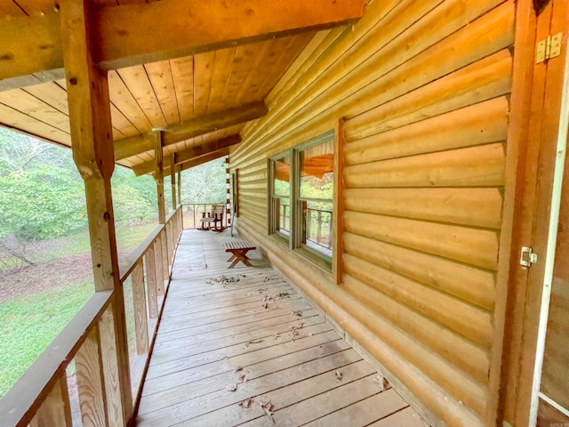 wooden terrace with a porch