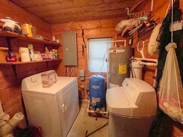 washroom with wooden walls, independent washer and dryer, electric water heater, and electric panel