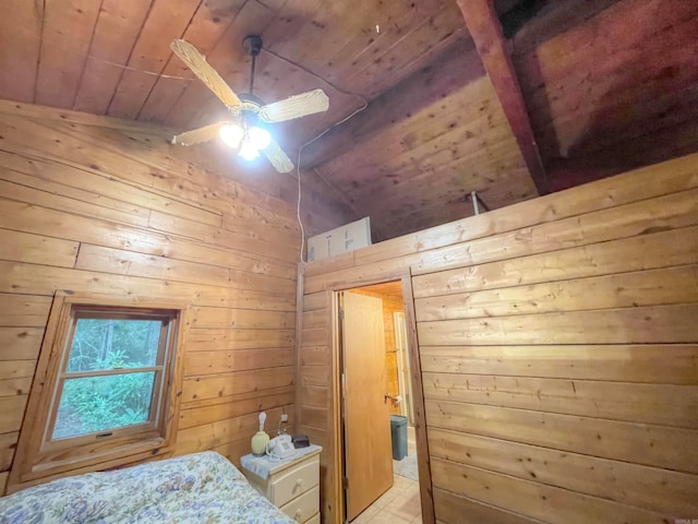 unfurnished bedroom with wooden walls, vaulted ceiling, ceiling fan, and wooden ceiling