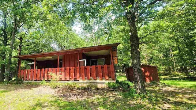 exterior space with a shed