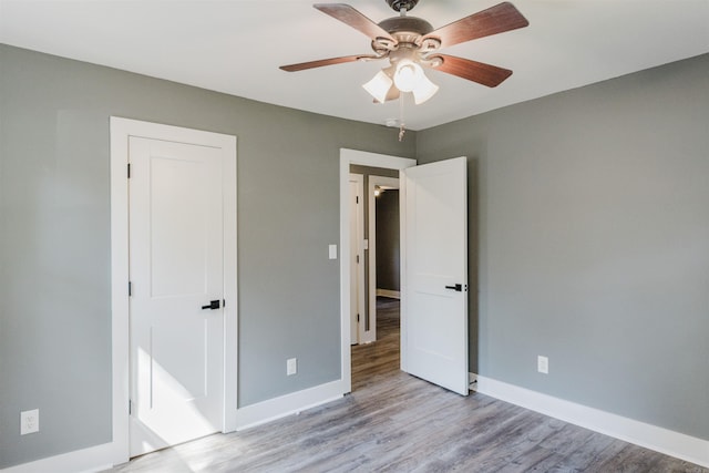 unfurnished bedroom featuring ceiling fan and light hardwood / wood-style flooring