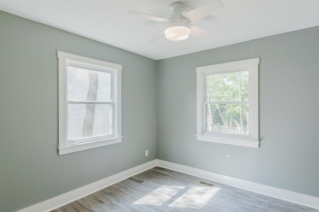 unfurnished room featuring light hardwood / wood-style floors and ceiling fan