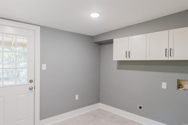 laundry room with hookup for a washing machine, cabinets, and hookup for an electric dryer