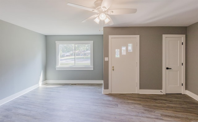 foyer entrance with ceiling fan and hardwood / wood-style flooring