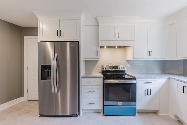 kitchen featuring stainless steel appliances, white cabinets, light stone counters, and backsplash