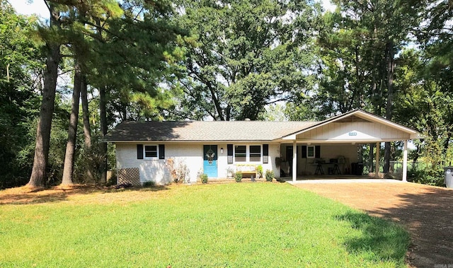 single story home featuring a carport and a front lawn