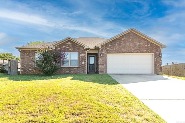 single story home featuring a garage and a front lawn