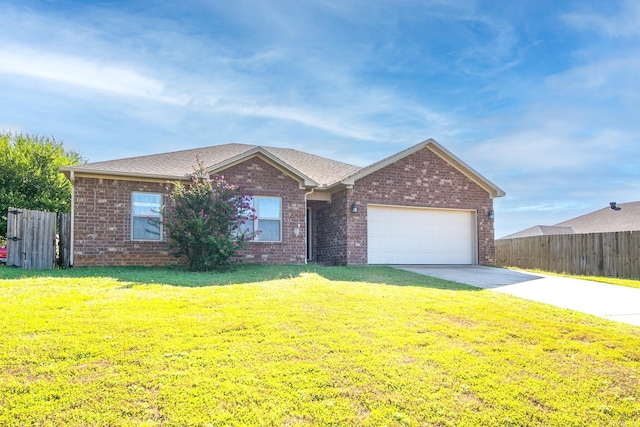 single story home with a front yard and a garage