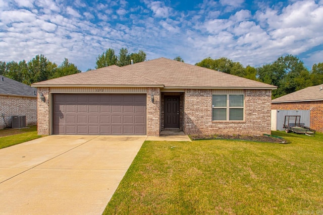 single story home featuring cooling unit, a garage, and a front lawn