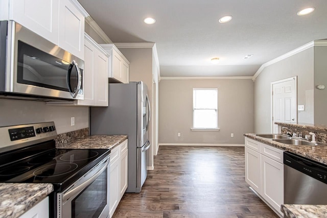 kitchen with sink, white cabinetry, stone counters, appliances with stainless steel finishes, and dark hardwood / wood-style flooring