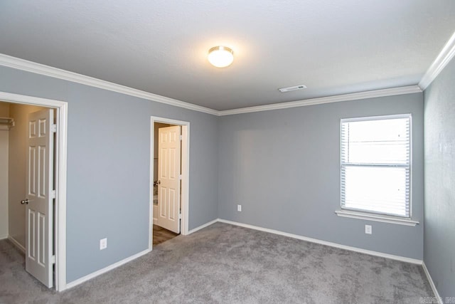 unfurnished bedroom with carpet flooring and ornamental molding