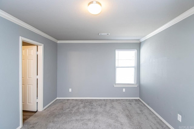 carpeted empty room with ornamental molding