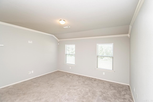 spare room with light carpet, lofted ceiling, and crown molding