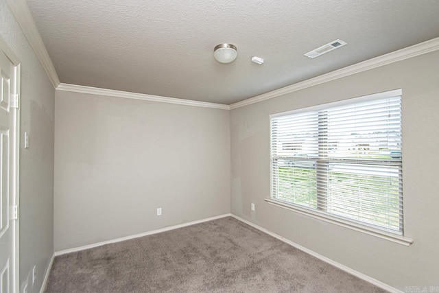 carpeted empty room featuring a textured ceiling and crown molding