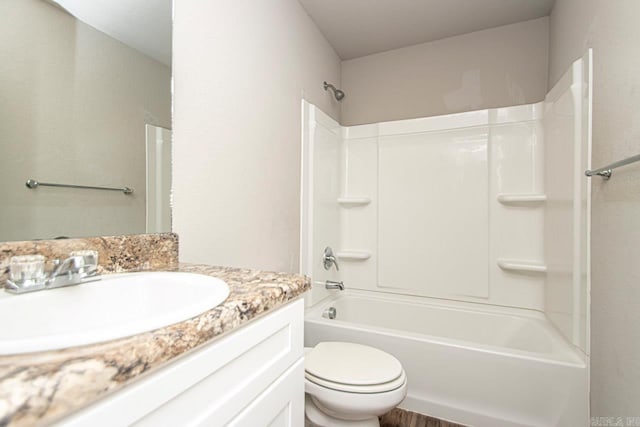 full bathroom featuring shower / bath combination, vanity, and toilet