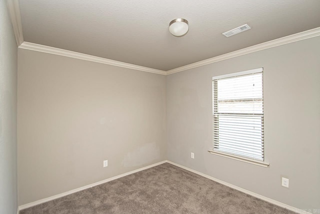 unfurnished room with a textured ceiling, carpet, and ornamental molding