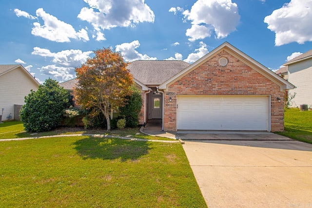 view of property with a front lawn and a garage